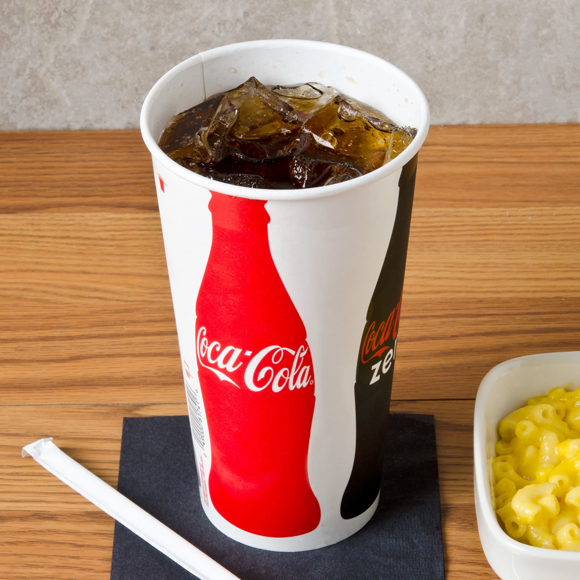 Solo RN32CB-K1038 Coke® 28-32 oz. Poly Paper Cold Cup - Image 1